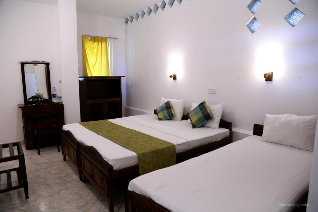 Postel nebo postele na pokoji v ubytování Dephani Beach Hotel
