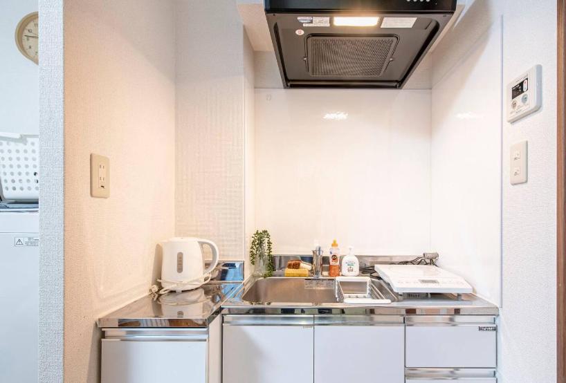 Kuchyň nebo kuchyňský kout v ubytování Uhome Tabata Apartment