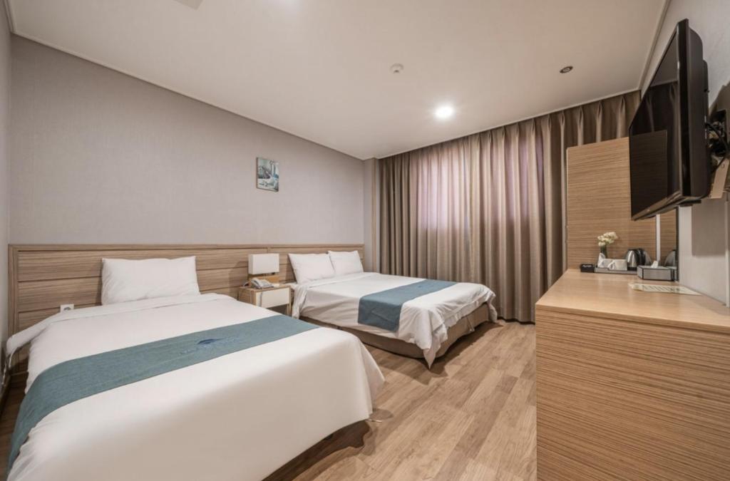 Postel nebo postele na pokoji v ubytování Blue Mountain Hotel