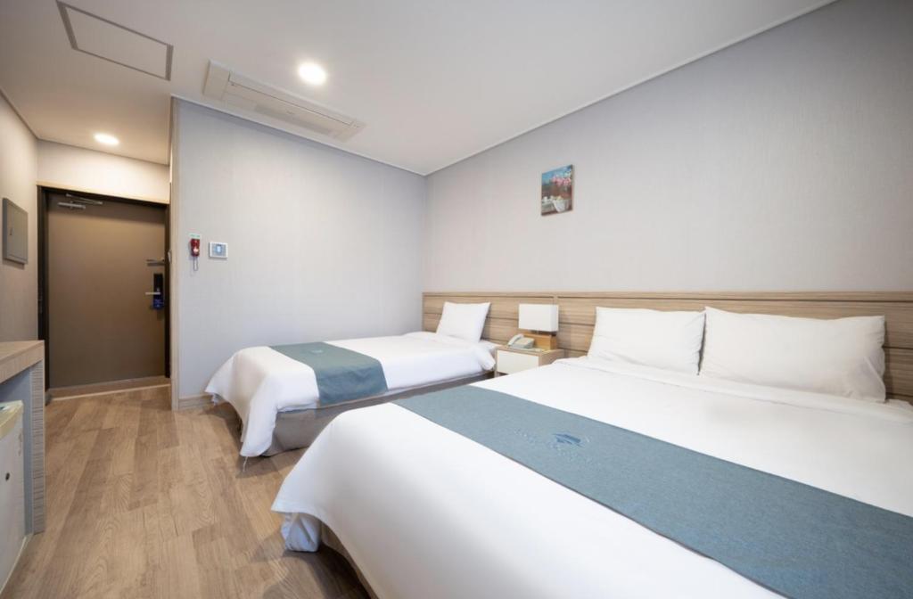 Postel nebo postele na pokoji v ubytování Blue Mountain Hotel