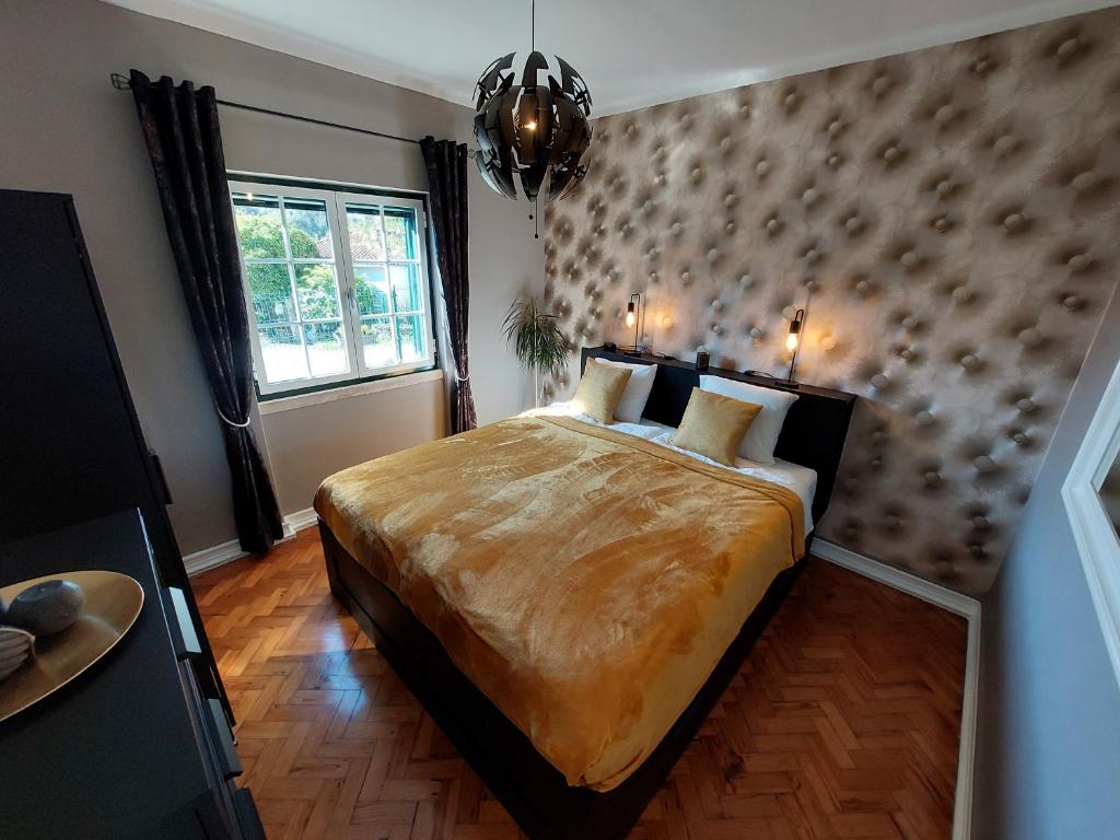 Postel nebo postele na pokoji v ubytování Casa Rio Zêzere
