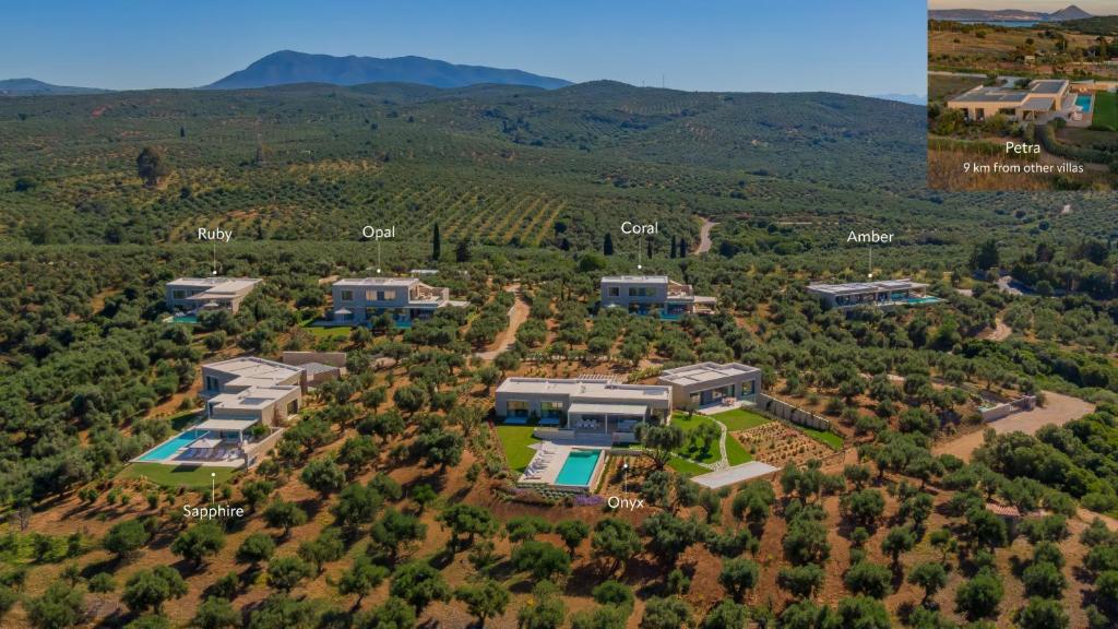 an aerial view of a house with a pool at Messinian Nest in Gialova