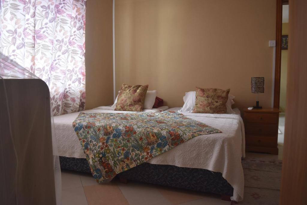 Postel nebo postele na pokoji v ubytování Blue Lagoon Villa