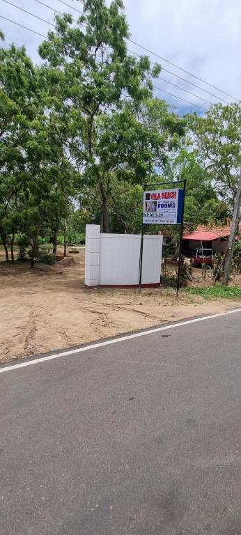 a sign sitting on the side of a road at Yala Reach Hotel in Tissamaharama