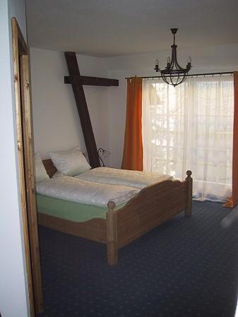 Postel nebo postele na pokoji v ubytování Hotel Schuberths am Markt