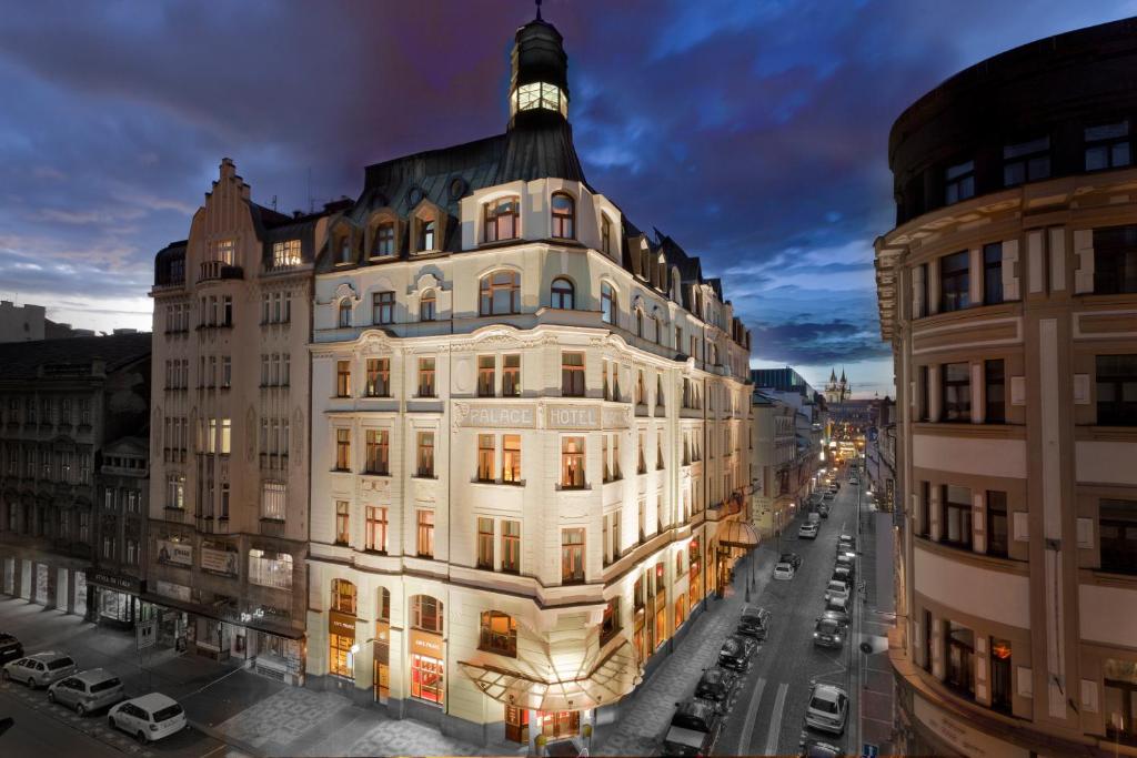 a tall white building with a dome on top of it at Art Nouveau Palace Hotel in Prague