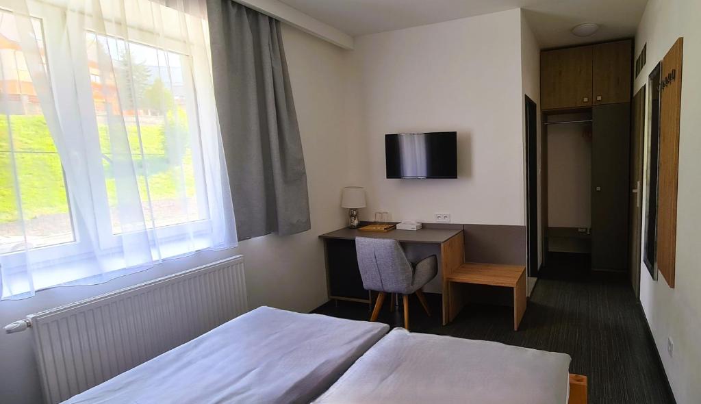 TV a/nebo společenská místnost v ubytování Hotel Fabrica