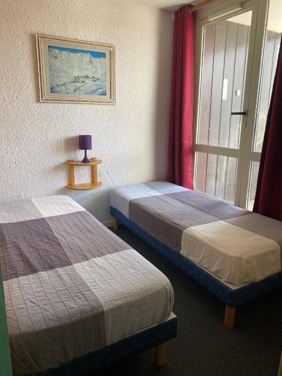 Postel nebo postele na pokoji v ubytování Hauts De Vanoise Appartements VTI