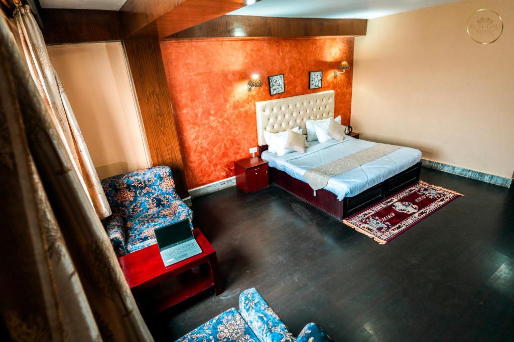 Postel nebo postele na pokoji v ubytování Kun Dau Residency