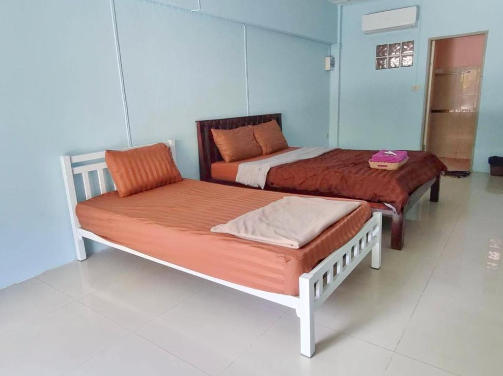 Postel nebo postele na pokoji v ubytování Banyan Resort Bangsaen