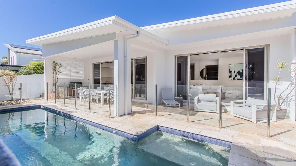 an image of a house with a swimming pool at Elliston House in Kingscliff