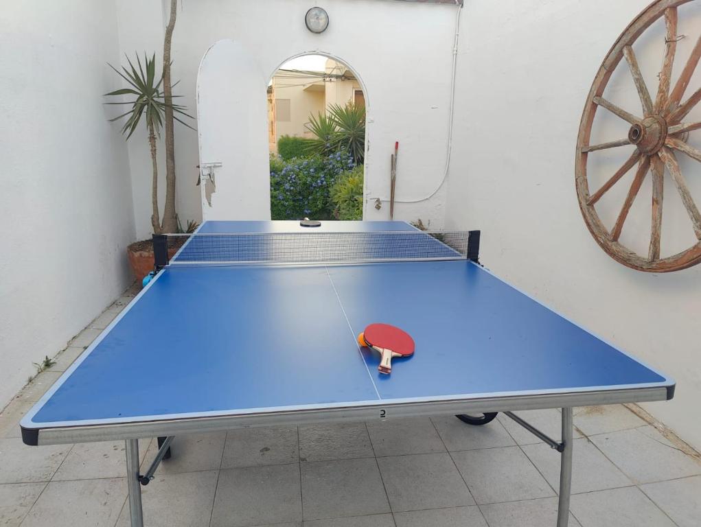 a blue ping pong table with a toy on it at Location, Location, Location in St. Julianʼs