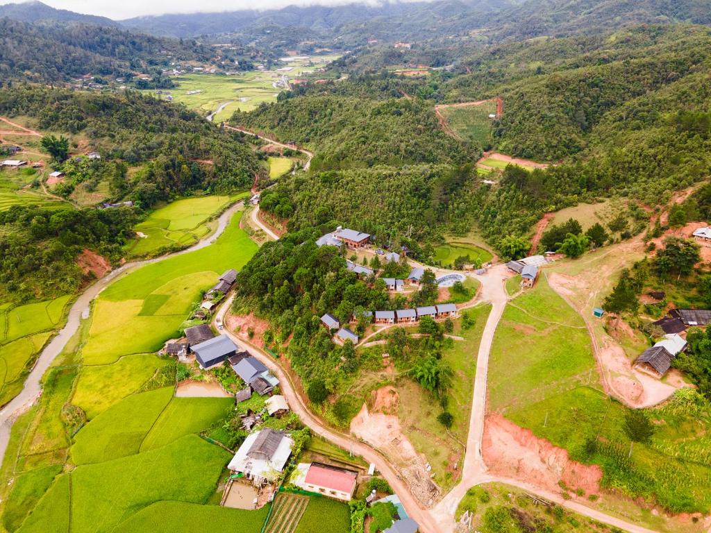 an aerial view of a village in the mountains at Lam Ecolodge Mu Cang Chai in Nam Khat