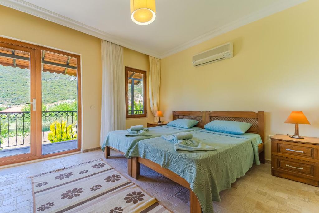 Postel nebo postele na pokoji v ubytování Villa Doğa