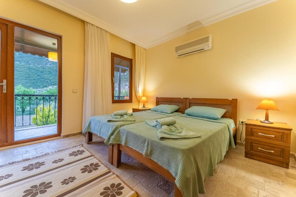 Postel nebo postele na pokoji v ubytování Villa Doğa