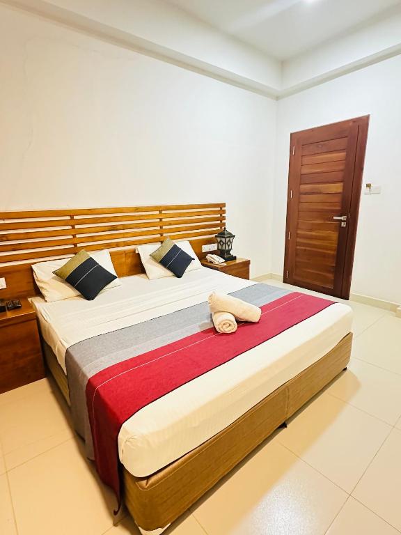Postel nebo postele na pokoji v ubytování Cafe Pinnalanda Rooms