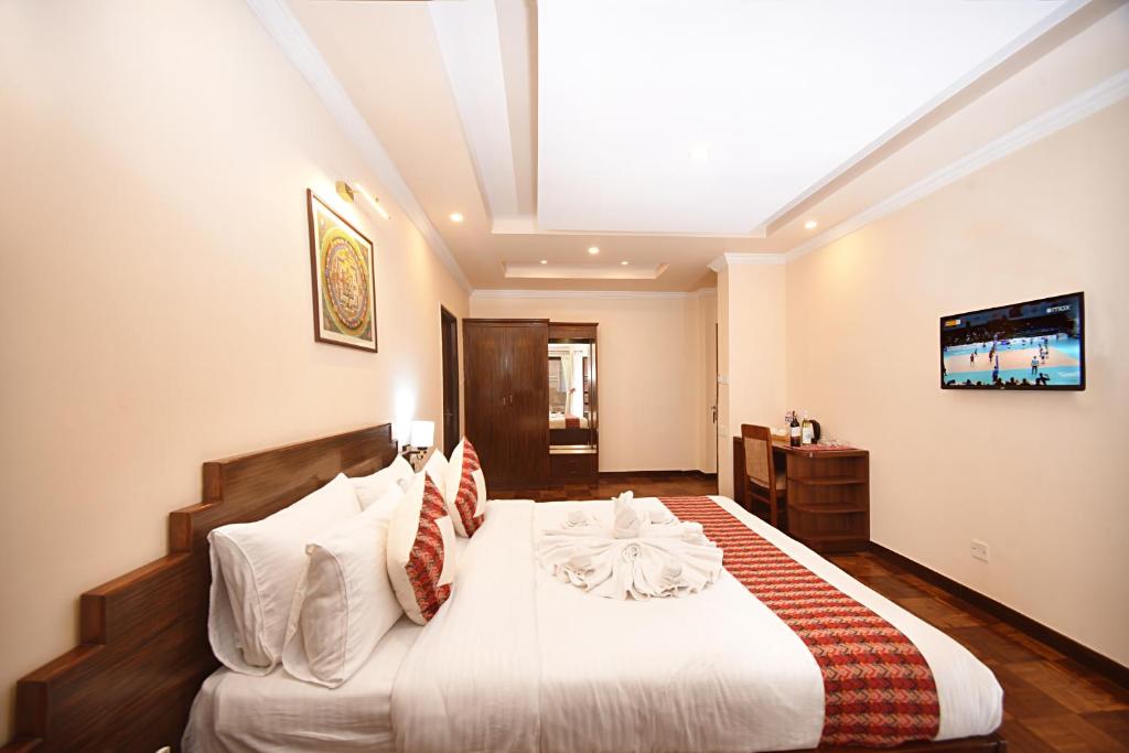 Postel nebo postele na pokoji v ubytování Skye Inn Kathmandu