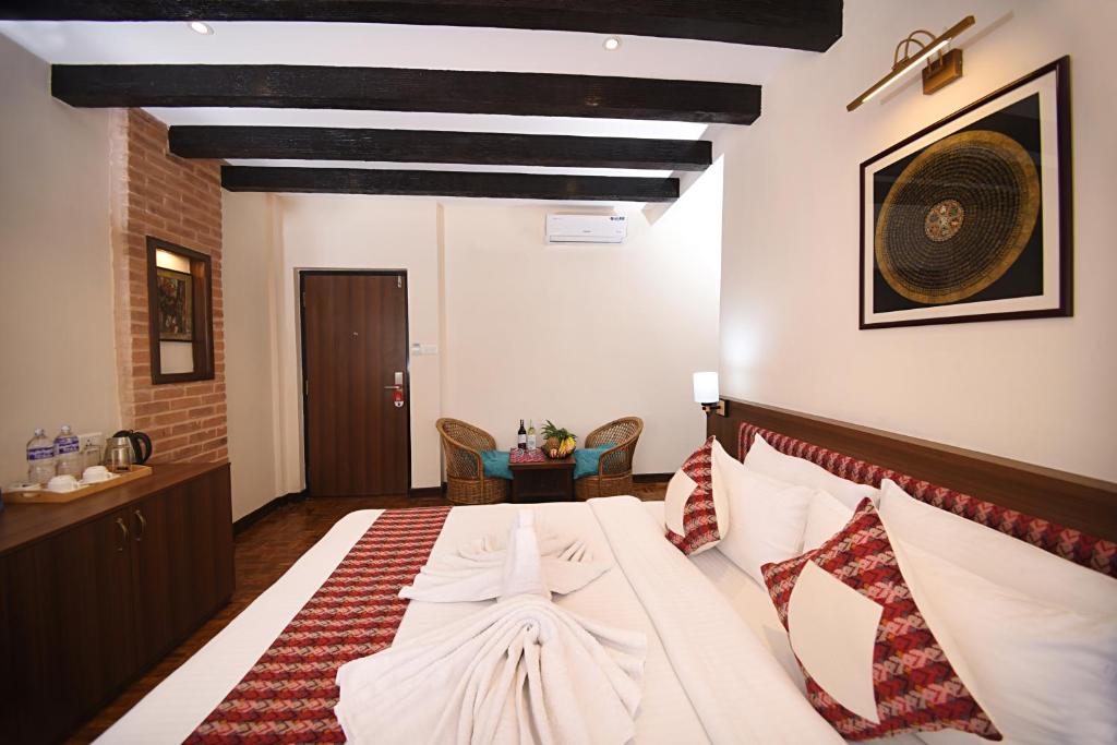 Postel nebo postele na pokoji v ubytování Skye Inn Kathmandu