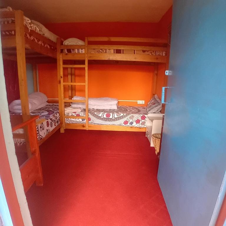 Postel nebo postele na pokoji v ubytování Namaste Home Stay