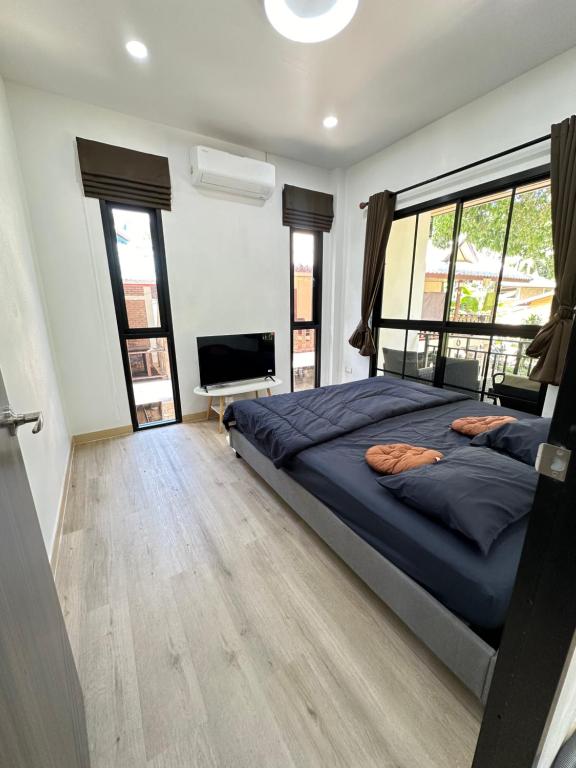 Ένα ή περισσότερα κρεβάτια σε δωμάτιο στο The Summer Cozy Cottage