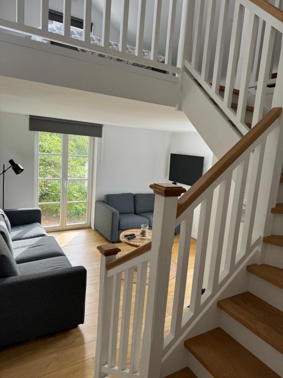 Posezení v ubytování Maison privative dans un environnement idyllique