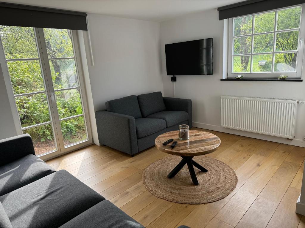 Posezení v ubytování Maison privative dans un environnement idyllique