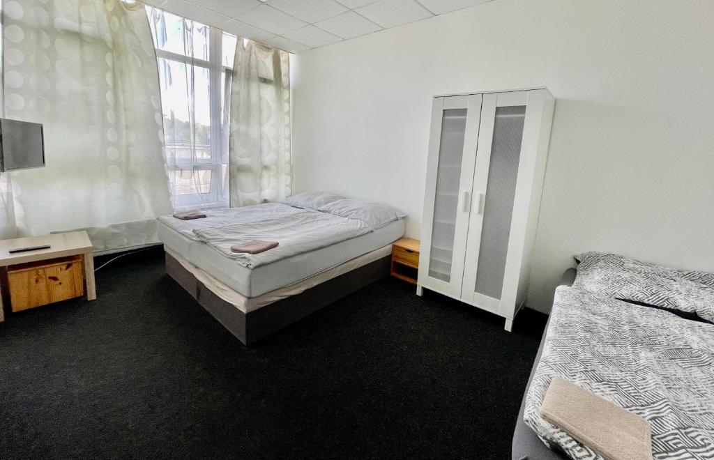 Postel nebo postele na pokoji v ubytování Apartmany Fit Gym