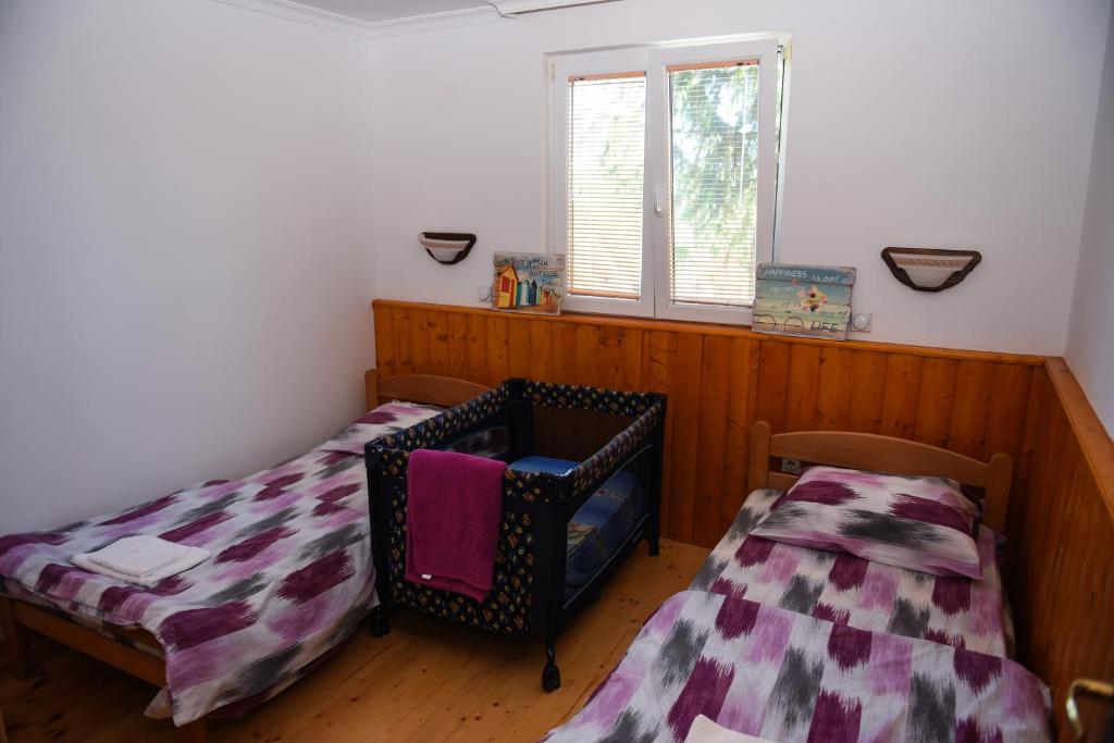 Postel nebo postele na pokoji v ubytování Green Pine House
