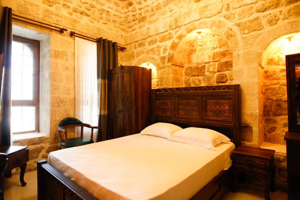 Postel nebo postele na pokoji v ubytování Minessa Konağı