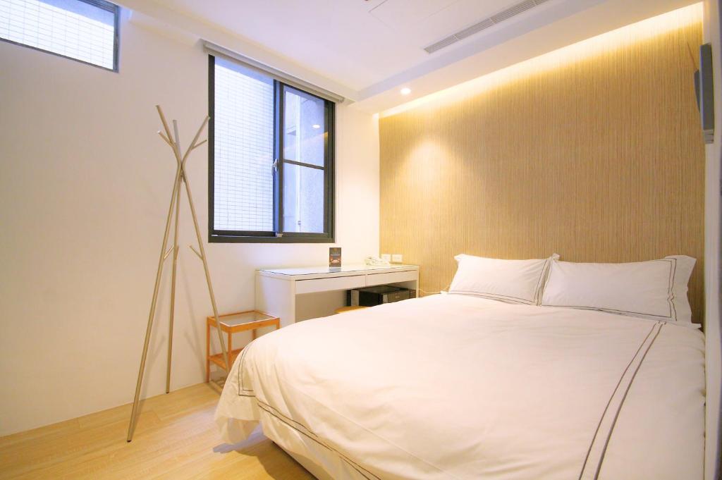 Postel nebo postele na pokoji v ubytování Mini West Hotel