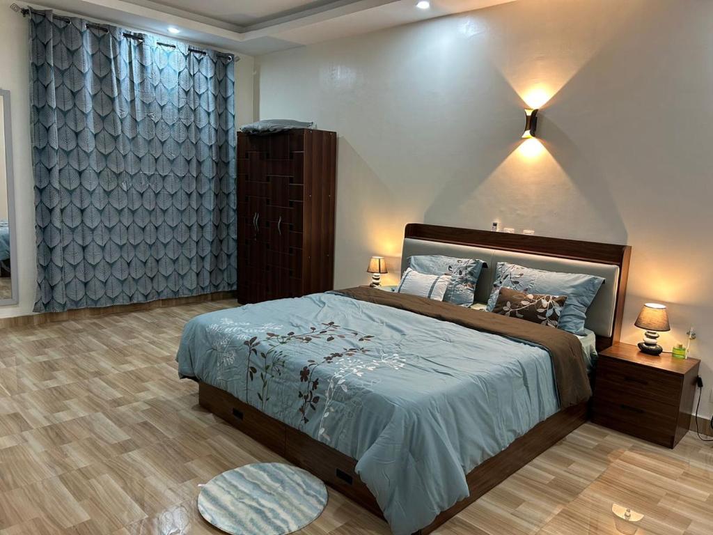 En eller flere senge i et værelse på Les Résidences Aya Et Fils 1