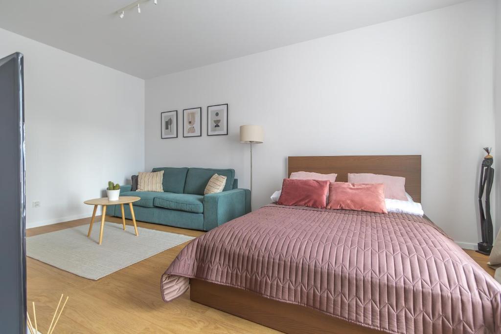Posteľ alebo postele v izbe v ubytovaní Glow Apartments, Gdańsk Śląska 12