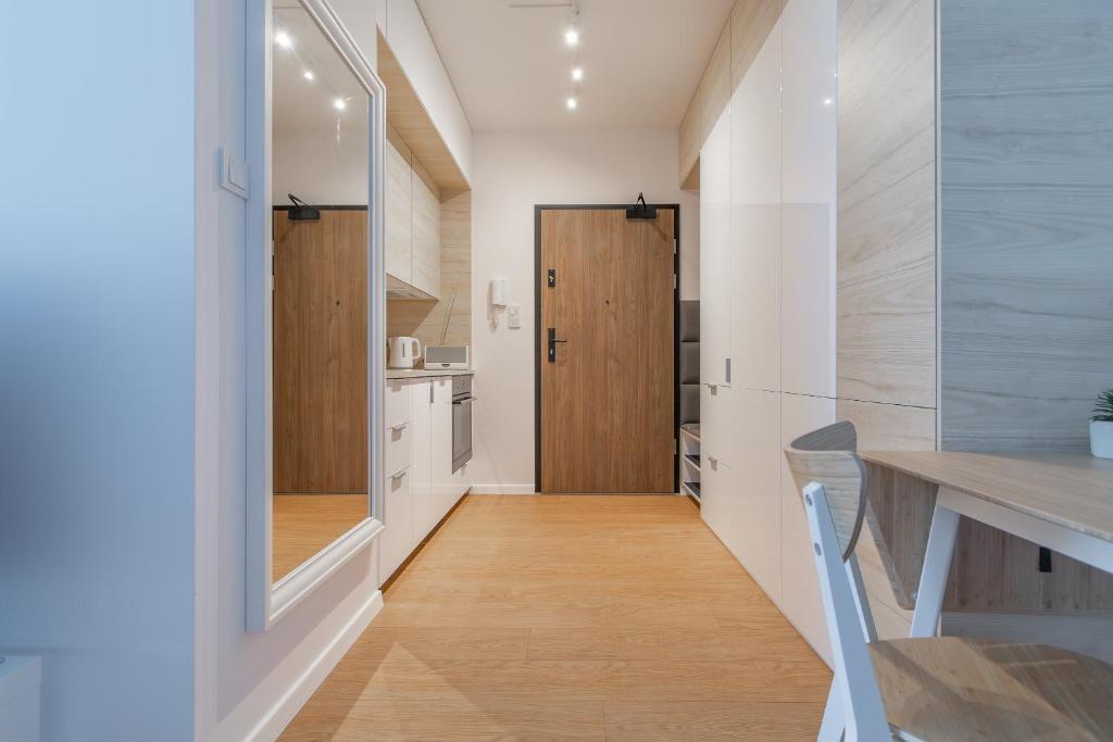 Kuchyňa alebo kuchynka v ubytovaní Glow Apartments, Gdańsk Śląska 12