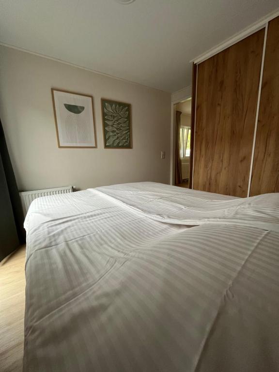 Postel nebo postele na pokoji v ubytování Chalet 't Zwaluwnest