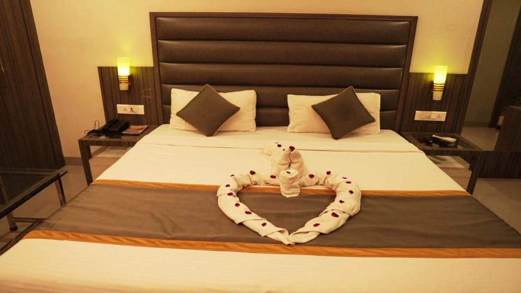 Postel nebo postele na pokoji v ubytování Hotel Royal Retreat