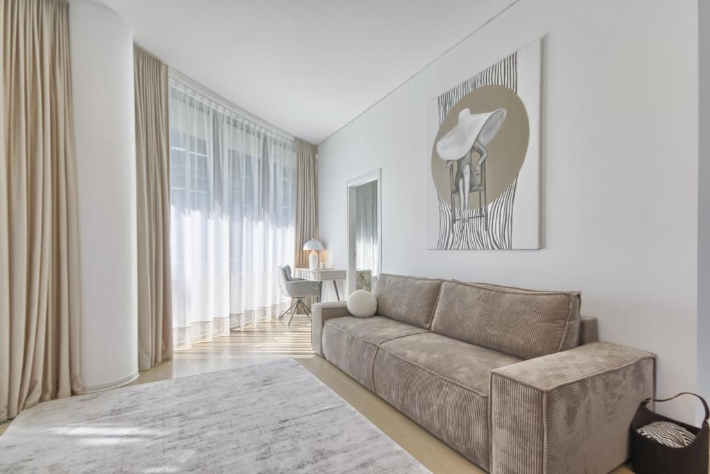 a living room with a couch and a table at Home In 2 in Druskininkai