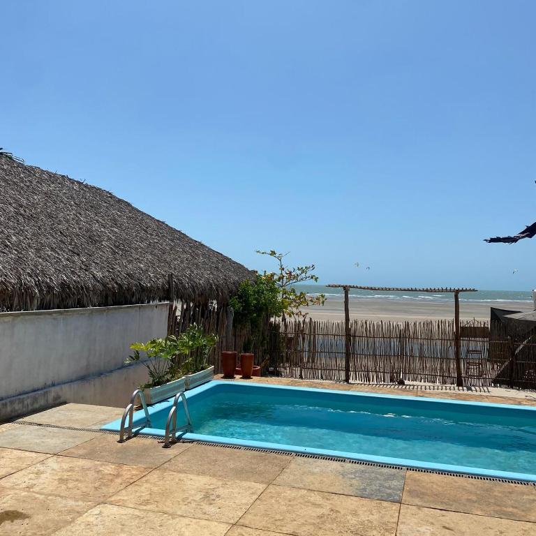 a swimming pool with a view of the beach at Casa Monã in Maceio