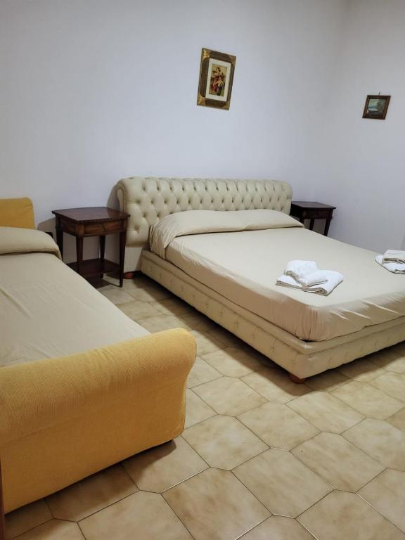 Postel nebo postele na pokoji v ubytování Appartamento Fotia