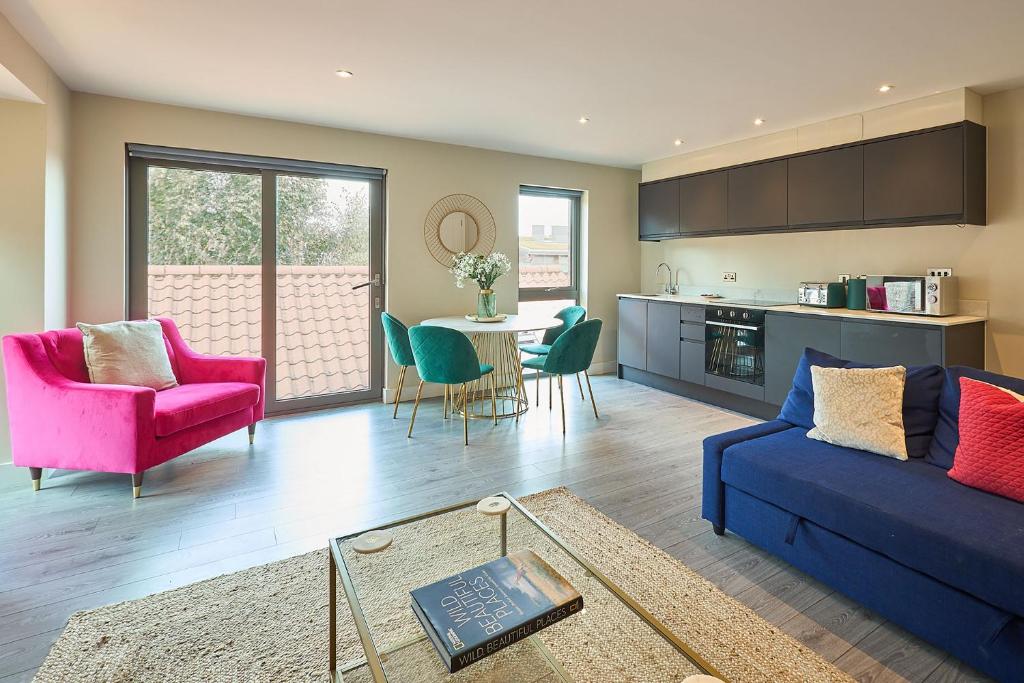 a living room with a couch and a table with chairs at Host & Stay - The Hideaway in York