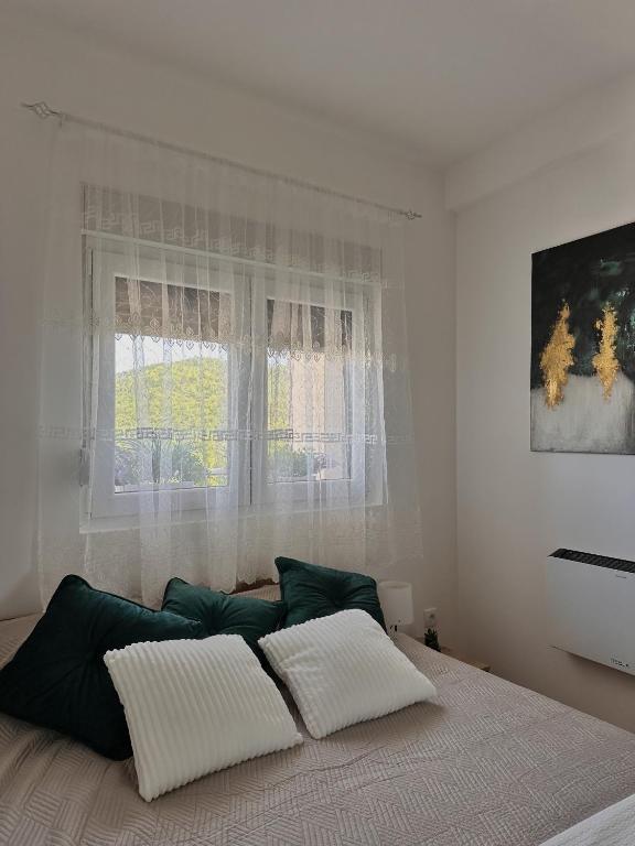 Postel nebo postele na pokoji v ubytování Aria Apartman Sokobanja