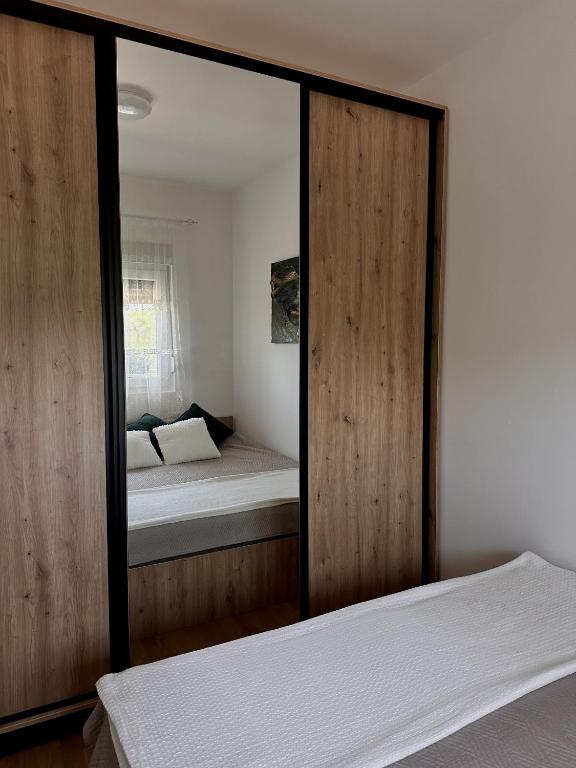 Postel nebo postele na pokoji v ubytování Aria Apartman Sokobanja
