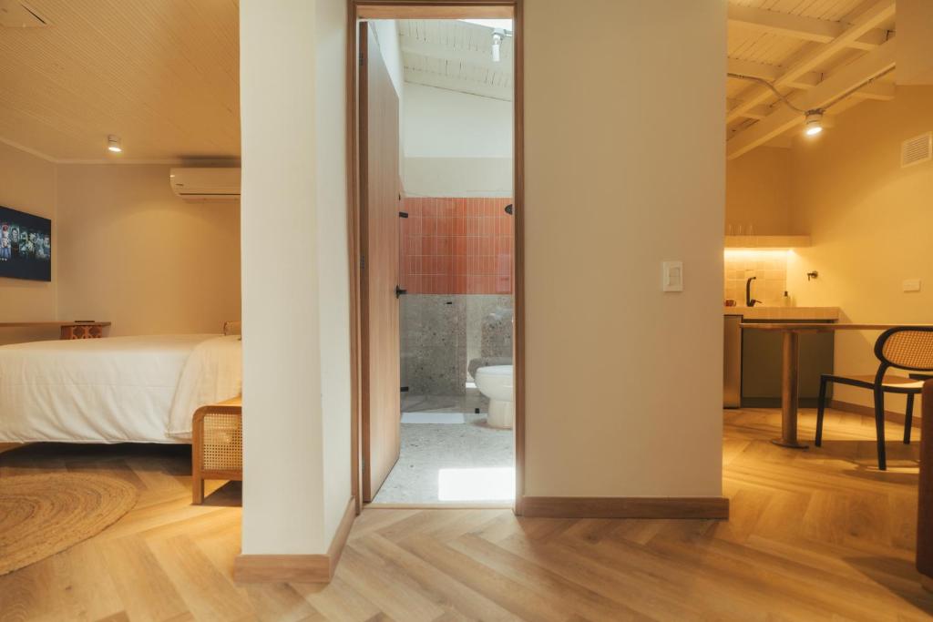 Postel nebo postele na pokoji v ubytování Hotel Boutique Roomzz Laureles
