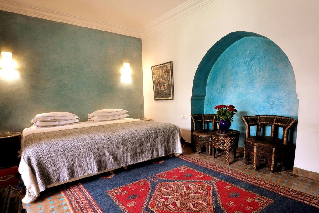 Postel nebo postele na pokoji v ubytování Marrakech Riads, Angsana Heritage Collection