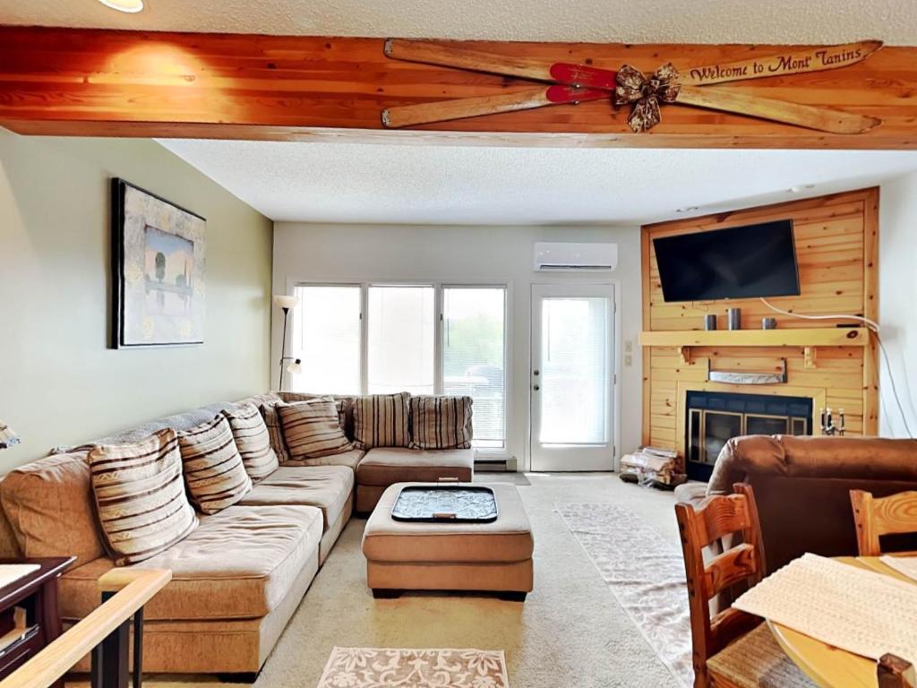 a living room with a couch and a fireplace at Deep Creek Village #31 in McHenry