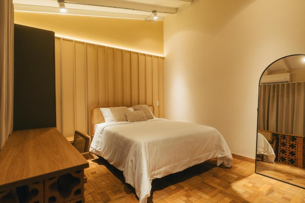 Postel nebo postele na pokoji v ubytování Hotel Boutique Roomzz Laureles