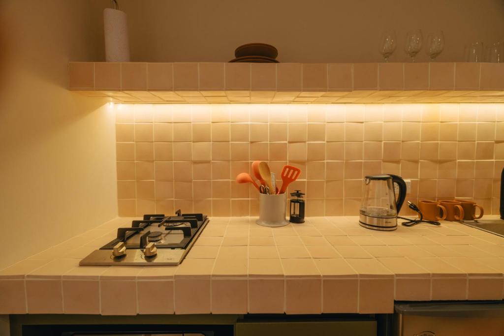 Kuchyň nebo kuchyňský kout v ubytování Hotel Boutique Roomzz Laureles