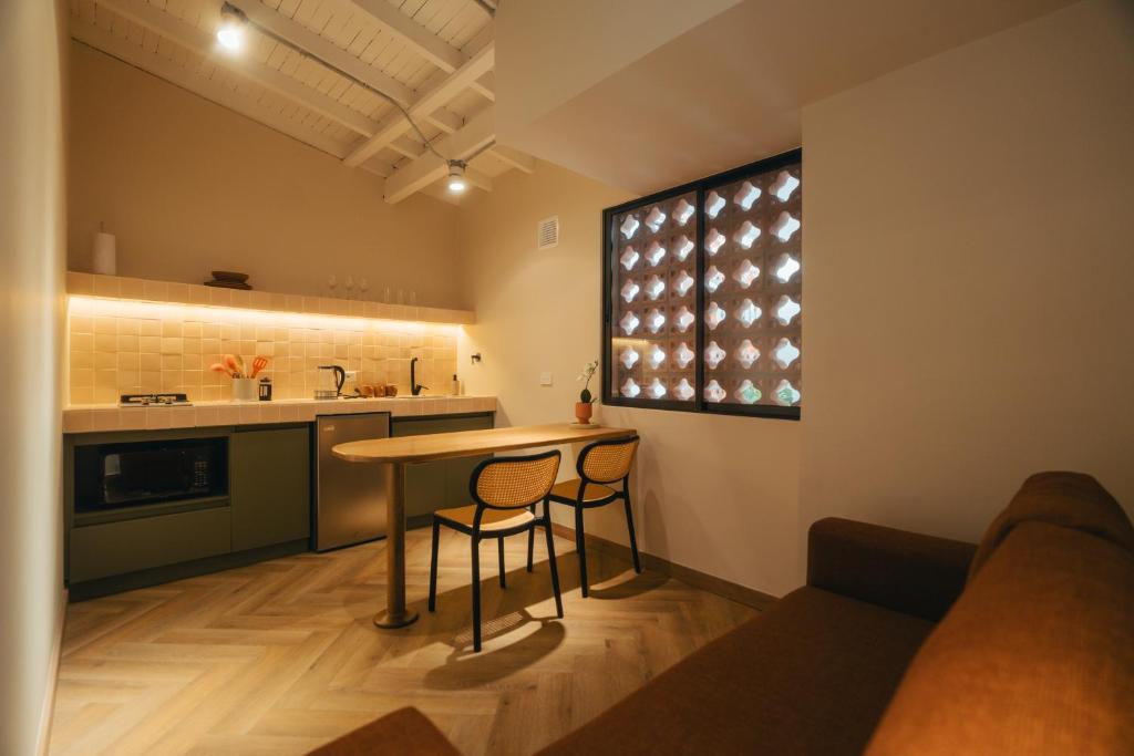 Kuchyň nebo kuchyňský kout v ubytování Hotel Boutique Roomzz Laureles