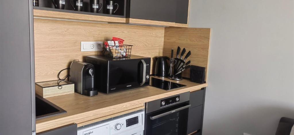 Kuchyň nebo kuchyňský kout v ubytování Apartmenthaus Oborishte - 17