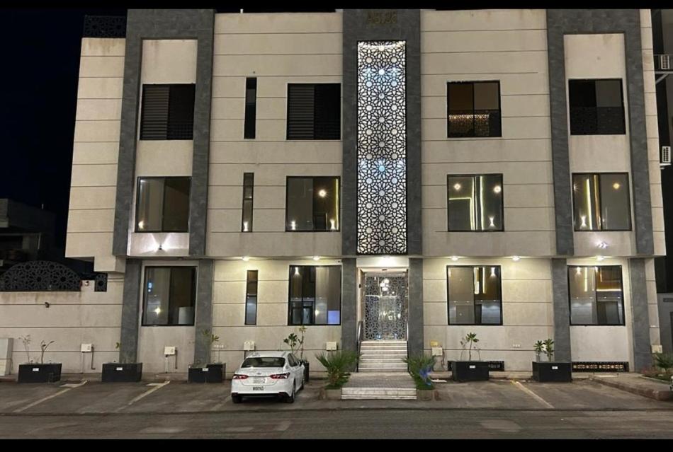 a white car parked in front of a building at شقه فاخره بجوار الراشد مول in Sīdī Ḩamzah