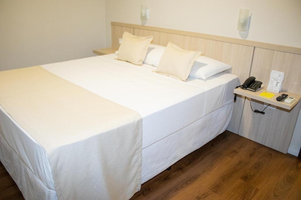 Postel nebo postele na pokoji v ubytování Golden Ingá Hotel